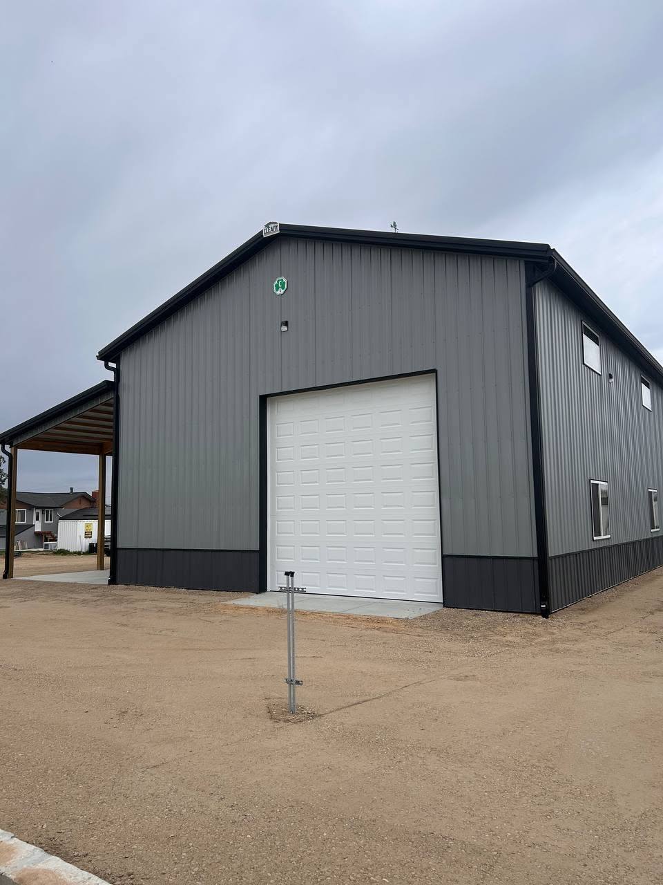 Seamless gutter along the eave of a commercial pole barn
