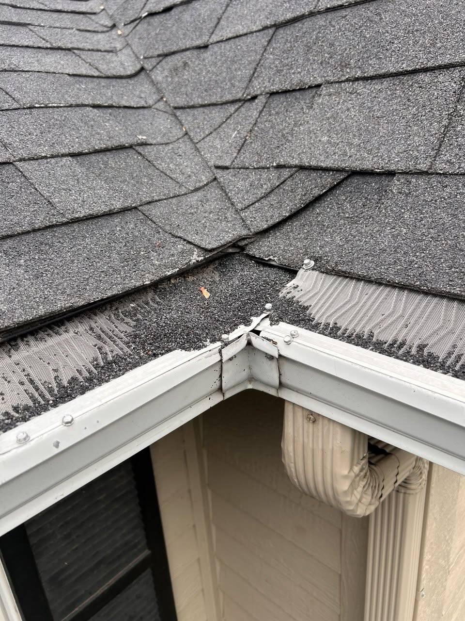 Roof valley, mitred corner and downspout outlet on a finished seamless install