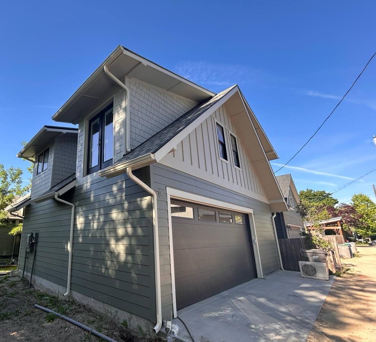 Seamless gutter and downspout on a grey two storey Treasure Valley home