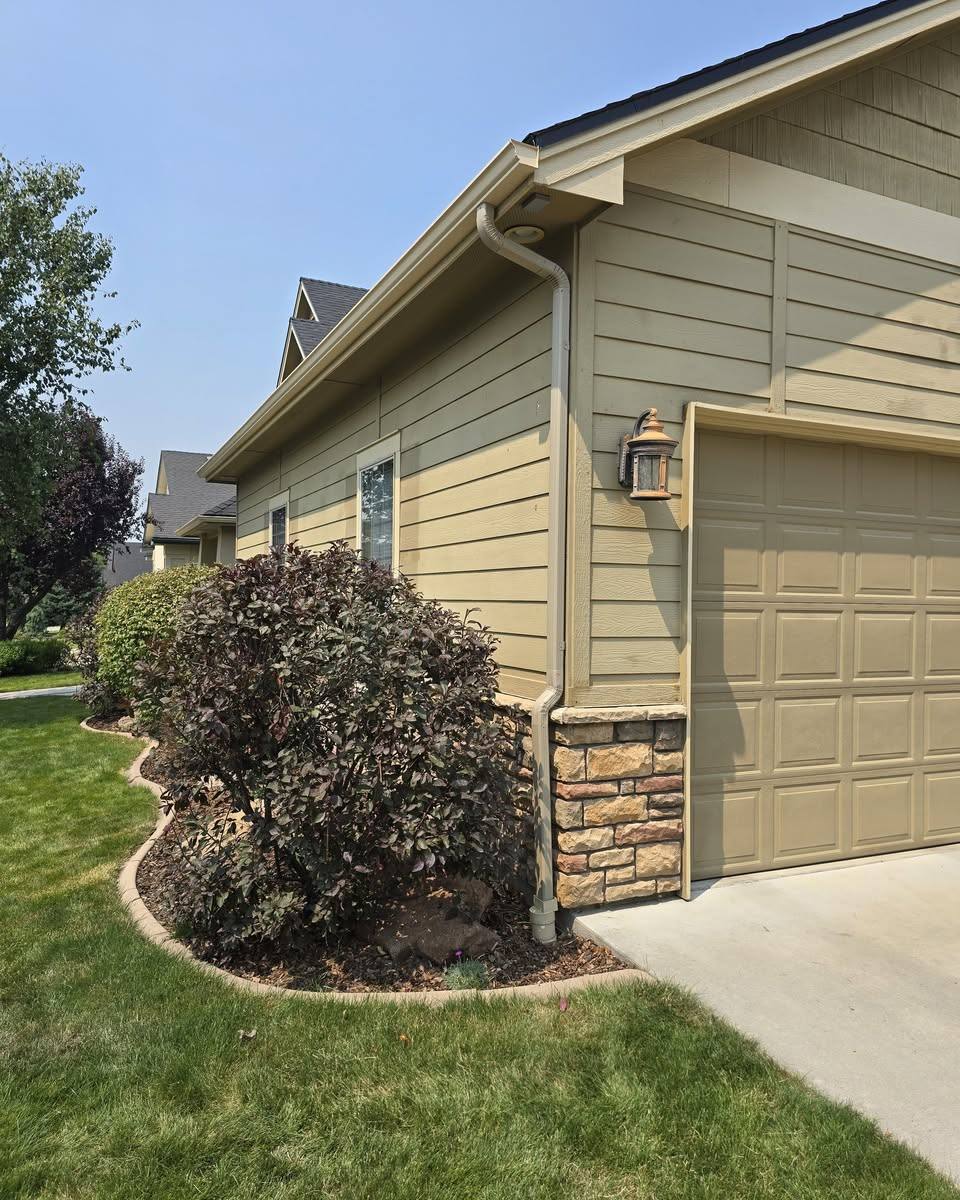 Front elevation of a family home with new seamless gutter