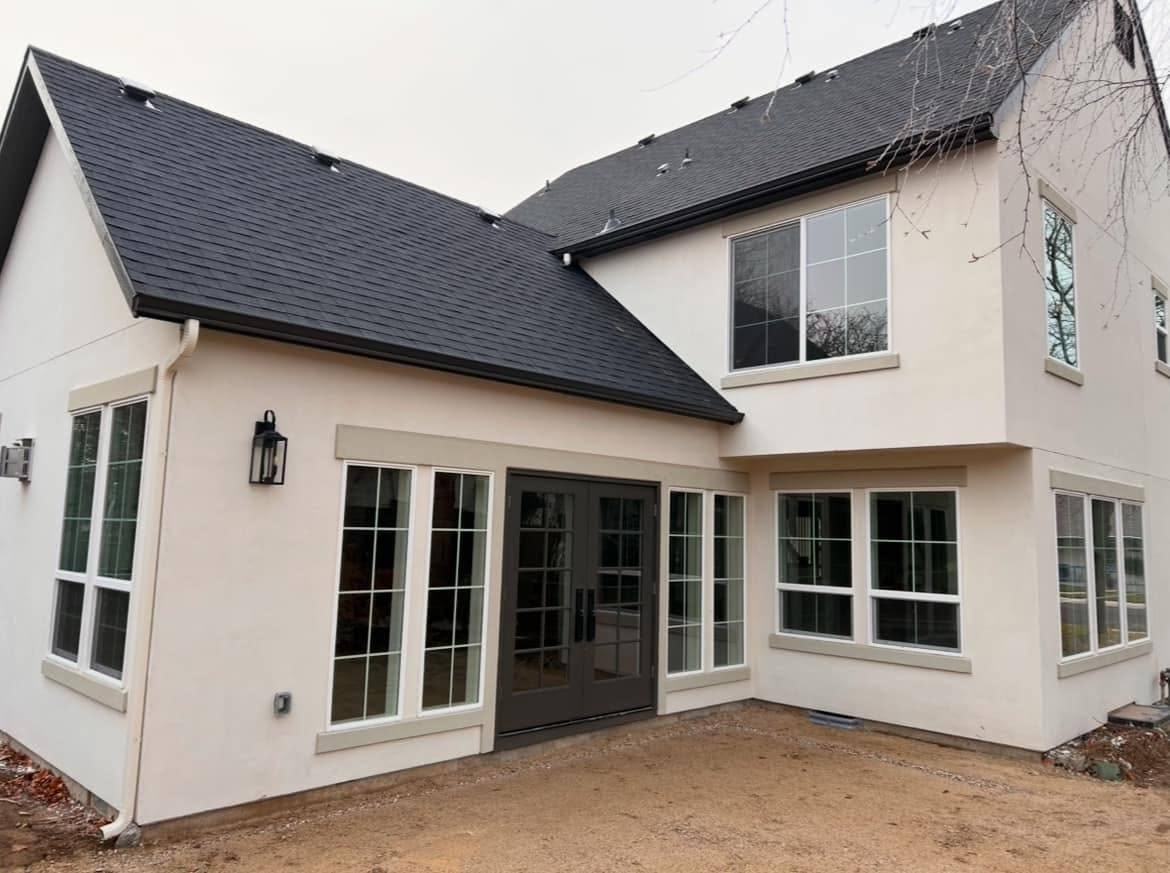 Finished seamless gutter on the rear elevation of a white Treasure Valley home